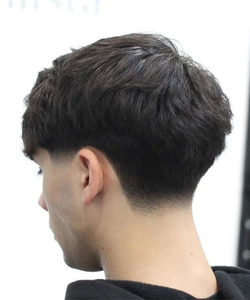 Modern taper fade haircut for men with natural finish